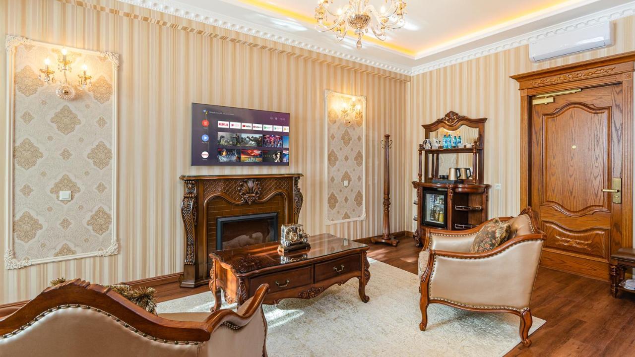 Gregory Boutique Hotel Кишинев Екстериор снимка A living room with a fireplace